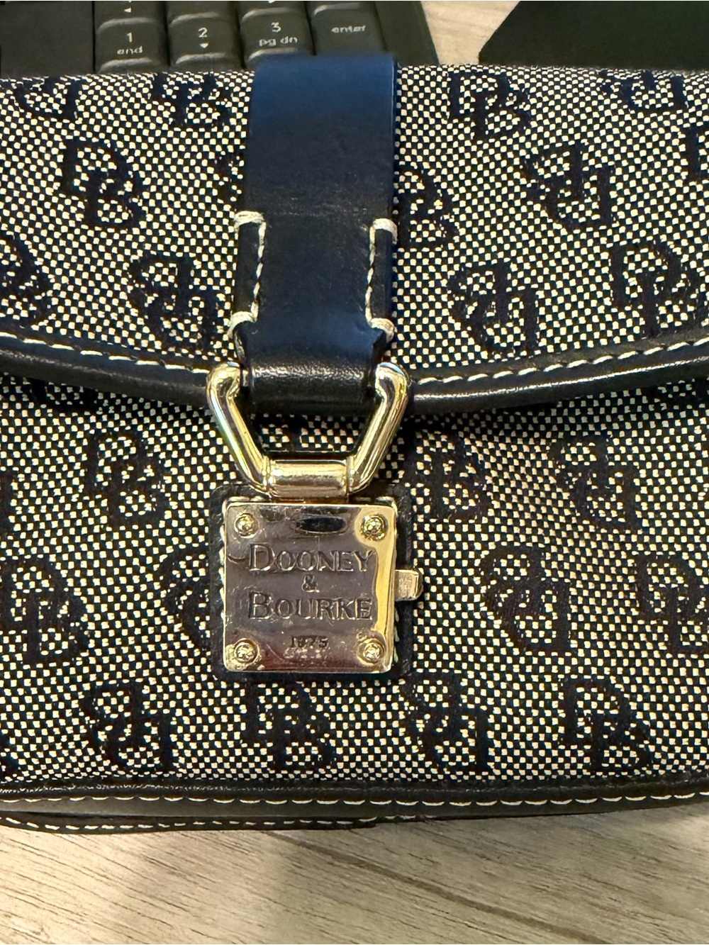 Dooney & Bourke Black and Tan Signature Clutch with Gold Hardware - Picture 2 of 4